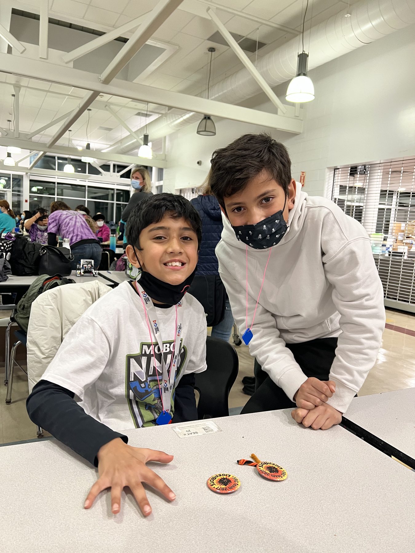 Mentoring a younger teammate at a robotics competition