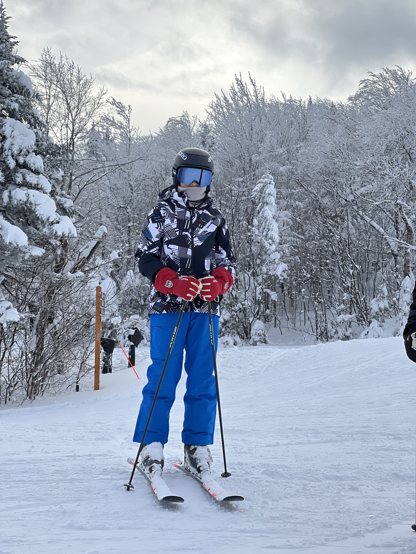 Me skiing down a snowy slope
